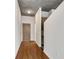 Hallway view with hardwood floors and concrete ceiling leading towards the main living areas at 860 Peachtree Ne St # 1912, Atlanta, GA 30308