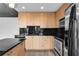 Bright kitchen with sleek countertops, stainless steel appliances, and modern black backsplash at 860 Peachtree Ne St # 1912, Atlanta, GA 30308