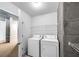Bright laundry room with white washer and dryer at 860 Peachtree Ne St # 1912, Atlanta, GA 30308