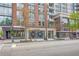 Street view of commercial area with several storefronts: Starbucks, Oars and Paddle, and Trust Bank at 860 Peachtree Ne St # 1912, Atlanta, GA 30308