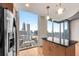 Bright kitchen with breakfast bar showcasing a large picture window with downtown city views at 860 Peachtree Ne St # 1912, Atlanta, GA 30308