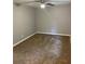 Bedroom showcasing neutral walls, plush carpet, and a modern ceiling fan at 1150 Rankin Street # D1, Stone Mountain, GA 30083