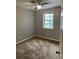 Bedroom featuring neutral walls, plush carpet, and a modern ceiling fan at 1150 Rankin Street # D1, Stone Mountain, GA 30083