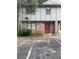 Charming townhome featuring a stone facade, neutral siding and a red front door at 1150 Rankin Street # D1, Stone Mountain, GA 30083