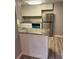 Well-lit kitchen featuring stainless steel appliances, granite counters, and white cabinets at 1150 Rankin Street # D1, Stone Mountain, GA 30083