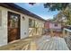 Charming backyard deck with a wooden door and white brick facade at 2349 Springdale Rd, Atlanta, GA 30315