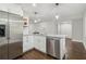 Modern kitchen with stainless steel appliances, white cabinets, and granite countertops at 2349 Springdale Rd, Atlanta, GA 30315
