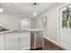Updated kitchen featuring granite countertops and stainless-steel dishwasher at 2349 Springdale Rd, Atlanta, GA 30315