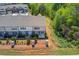 An aerial shot shows a building with lush greenery, offering privacy and picturesque scenery at 2378 Morgan Creek Rd, Buford, GA 30519