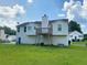 Exterior of home from backyard showing a deck and green grass at 3059 Brass Dr, Austell, GA 30106