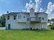Exterior of home from backyard showing a deck and green grass at 3059 Brass Dr, Austell, GA 30106