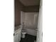 Small bathroom with a white tub and shower, toilet, and vanity at 3059 Brass Dr, Austell, GA 30106
