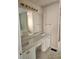 Bright bathroom featuring a vanity sink, a large mirror, and modern lighting at 3059 Brass Dr, Austell, GA 30106