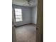 View of bedroom, showing neutral carpet and a window at 3059 Brass Dr, Austell, GA 30106