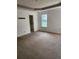 Bedroom with natural lighting, a double tray ceiling and neutral-colored carpeting at 3059 Brass Dr, Austell, GA 30106