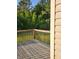 Spacious deck with a wood railing overlooks a lush, wooded backyard at 3059 Brass Dr, Austell, GA 30106