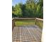 Spacious deck with a wood railing overlooks a lush, wooded backyard at 3059 Brass Dr, Austell, GA 30106