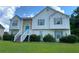 Charming two-story home with stone accents, blue door, and landscaped front yard at 3059 Brass Dr, Austell, GA 30106