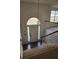 Bright foyer featuring arched window over the door and stairway to the second floor at 3059 Brass Dr, Austell, GA 30106