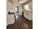 Well-lit kitchen featuring modern appliances, spacious countertops, and wood flooring at 3059 Brass Dr, Austell, GA 30106