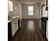 Bright kitchen with modern appliances, an abundance of counter space, and wood flooring at 3059 Brass Dr, Austell, GA 30106