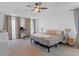 Spacious bedroom with ceiling fan, carpet floors, and lots of natural light at 4098 Haleston Rd, Duluth, GA 30097