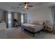 Large bedroom with a ceiling fan, two windows with drapes and space for a home office at 4098 Haleston Rd, Duluth, GA 30097