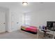 Bright bedroom with a bed and large desk, perfect for studying at 4098 Haleston Rd, Duluth, GA 30097