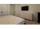 Well-lit bedroom with TV, closet, and a dresser at 4098 Haleston Rd, Duluth, GA 30097