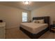 Comfortable bedroom featuring a queen-size bed and neutral decor at 4098 Haleston Rd, Duluth, GA 30097