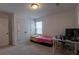 Spare bedroom featuring a bed, desk, and ample storage at 4098 Haleston Rd, Duluth, GA 30097
