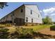 Angle view of the side and back exterior, featuring the home's clean lines and yard at 4098 Haleston Rd, Duluth, GA 30097