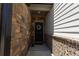 Inviting front entrance features a brick wall and decorative floral wreath at 4098 Haleston Rd, Duluth, GA 30097