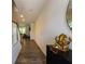 Hallway with wood floors leading to living spaces, adorned with modern decor at 4098 Haleston Rd, Duluth, GA 30097