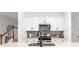 Bright kitchen features modern white cabinets, quartz countertops, and stainless steel appliances at 4098 Haleston Rd, Duluth, GA 30097