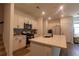 Well-lit kitchen with white cabinets, stone countertops, and stainless steel appliances at 4098 Haleston Rd, Duluth, GA 30097