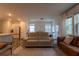 Comfortable living room with modern furnishings and open layout to kitchen area at 4098 Haleston Rd, Duluth, GA 30097