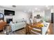 Spacious open-concept living area featuring a dining table, kitchen island, and a cozy living room at 4098 Haleston Rd, Duluth, GA 30097