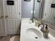 Bathroom featuring double sinks with updated fixtures and stylish gray accents at 4172 Howell Park Road, Duluth, GA 30096