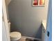 Powder room with toilet, vanity, and neutral color scheme at 4172 Howell Park Road, Duluth, GA 30096