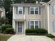 Inviting home with blue shutters, a charming front porch, and well-maintained landscaping at 4172 Howell Park Road, Duluth, GA 30096