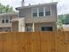 Exterior view of the house, showing the back of the property and a wooden fence at 4172 Howell Park Road, Duluth, GA 30096