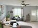 Bright living room with large windows, neutral walls, and stylish furnishings at 4172 Howell Park Road, Duluth, GA 30096