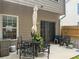Outdoor patio with a dining set and a sliding glass door leading inside at 4172 Howell Park Road, Duluth, GA 30096