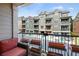 Relaxing balcony with outdoor seating and a view of the surrounding condo complex at 6459 Chariot St # 35, Atlanta, GA 30328