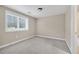 Well-lit bedroom with carpet floor and a view outside the window at 6459 Chariot St # 35, Atlanta, GA 30328