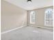 Spacious bedroom with carpet floors and large windows providing natural light at 6459 Chariot St # 35, Atlanta, GA 30328