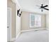 Cozy bedroom with neutral walls, ceiling fan, and window with natural lighting at 6459 Chariot St # 35, Atlanta, GA 30328