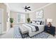 Comfortable bedroom with a ceiling fan, a patterned area rug, and natural lighting at 6459 Chariot St # 35, Atlanta, GA 30328