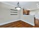 Bright dining area with elegant lighting fixture and pass-through view to the kitchen at 6459 Chariot St # 35, Atlanta, GA 30328
